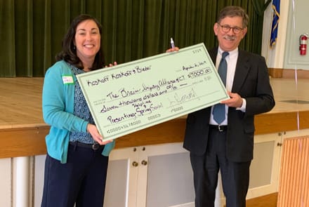 Michael Hortwitz presenting a check