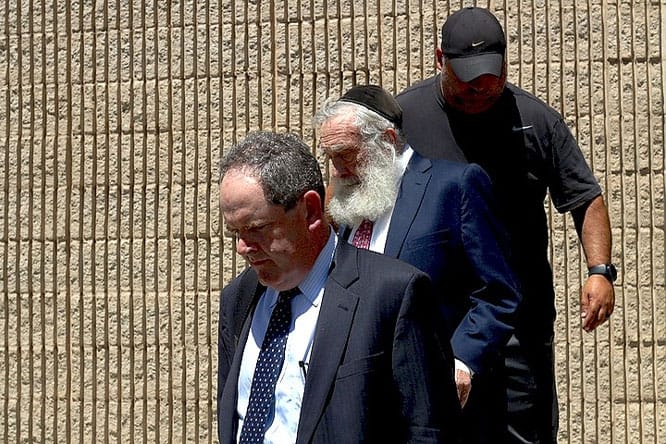 Daniel Greer leaves NHPD with attorney Grudberg and bondsman Constantinople.