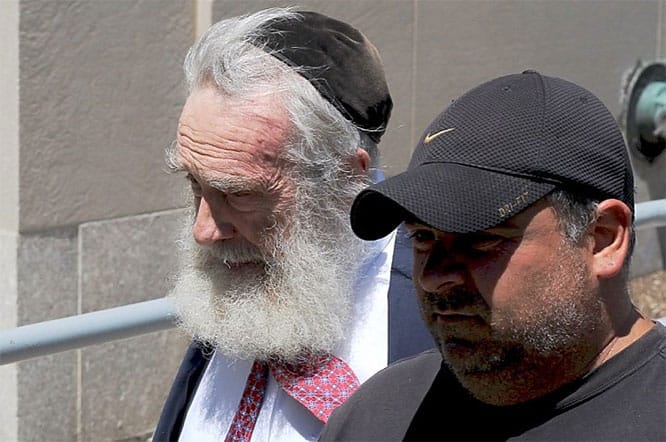 Daniel Greer leaves police headquarters Wednesday with bail bondsman Anthony Constantinople.